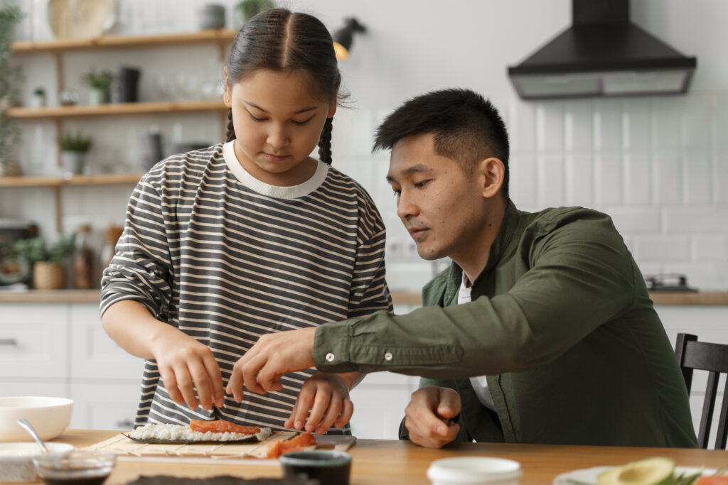 The Evolving Role of Nutritionists in Personalized Diet Planning 2 parent teaching kid how make sushi